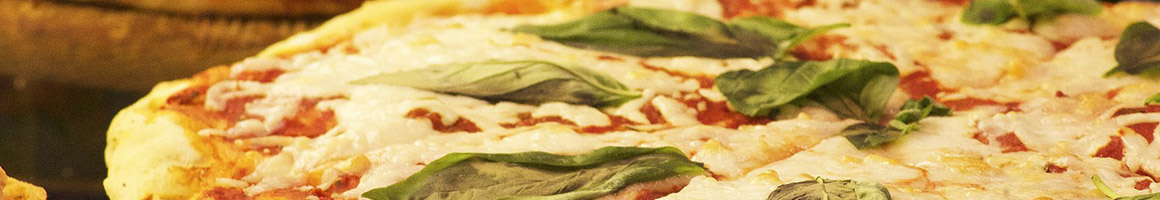 Eating Italian Pizza at Roma Pizzeria restaurant in Cutchogue, NY.